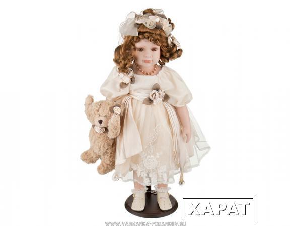 Фото Кукла фарфоровая в кремовом платье высота 55 см