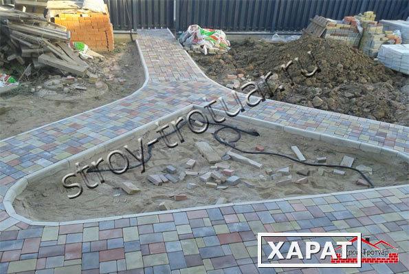 Фото Укладка тротуарной плитки на бетонное основание цена