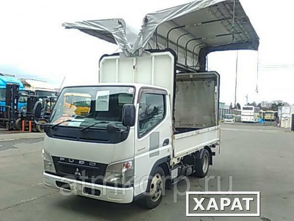 Фото Грузовик бортовой тентованный бабочка MITSUBISHI CANTER кузов FE70BS гв 2010 груз 2 т пробег 45 т.км