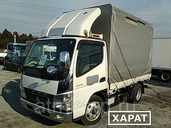 Фото Грузовик бортовой тентованный MITSUBISHI CANTER кузов FE70D год вып 2010 грузоподъемность 3 тн пробег 63 т.км