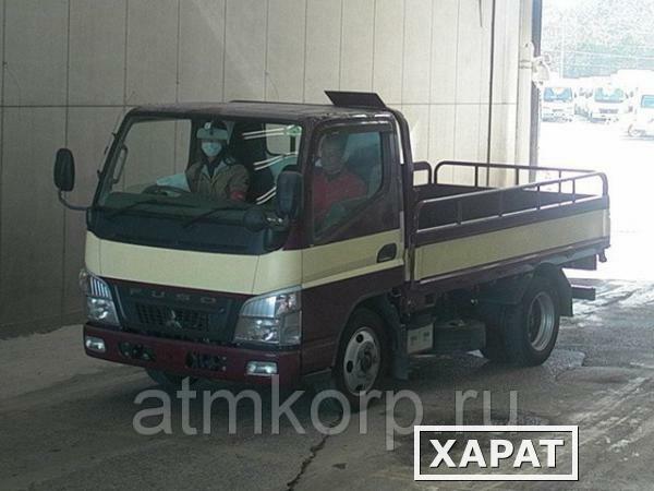 Фото Грузовик бортовой MITSUBISHI CANTER кузов FE70D год выпуска 2010 грузоподъемность 2 тонны пробег 239 тыс км