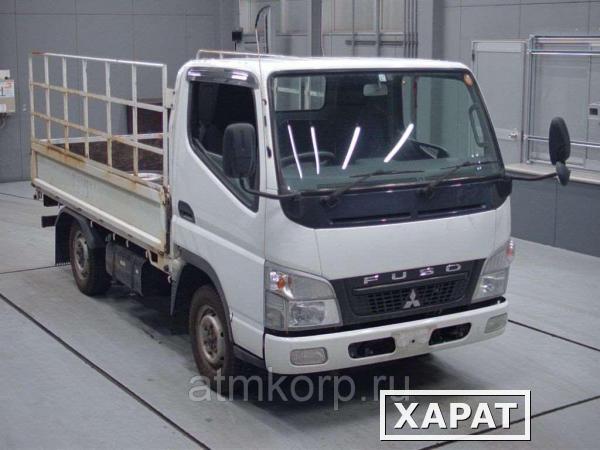 Фото Грузовик бортовой MITSUBISHI CANTER кузов FD70B гв 2011 полный привод 4х4 грузопод 1,5 тн пробег 252 т.км