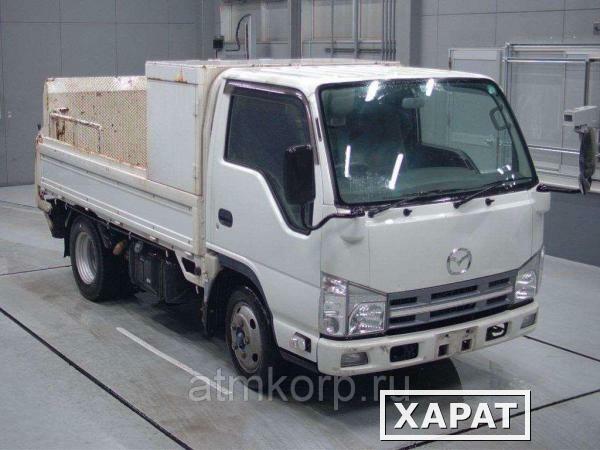 Фото Грузовик бортовой MAZDA TITAN кузов LKR85A год выпуска 2012 гидроборт грузоподъемность 2 тн пробег 60 тыс км