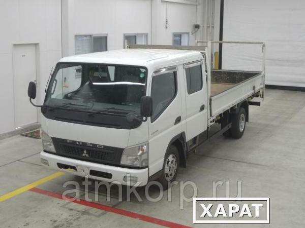 Фото Грузовик двухкабинник бортовой MITSUBISHI CANTER кузов FE82D гв 2010 кабина 6 мест груз 3 тн пробег 132 т.км