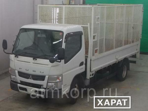 Фото Грузовик бортовой MITSUBISHI CANTER кузов FEA50 год выпуска 2012 грузоподъемность 2 тонны пробег 57 тыс км