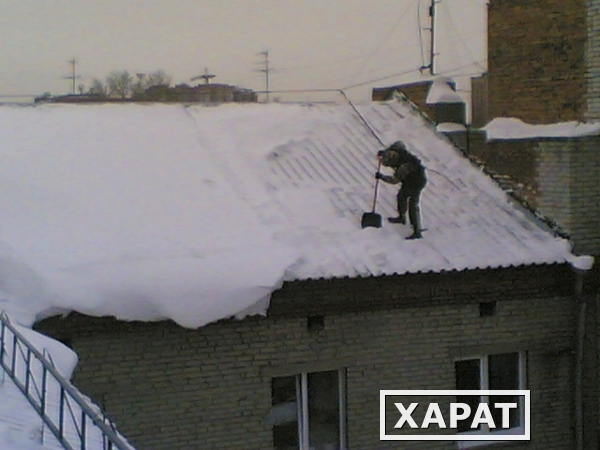 Фото Чистка снега с крыш. Удаление сосулек и наледи в Новосибирске