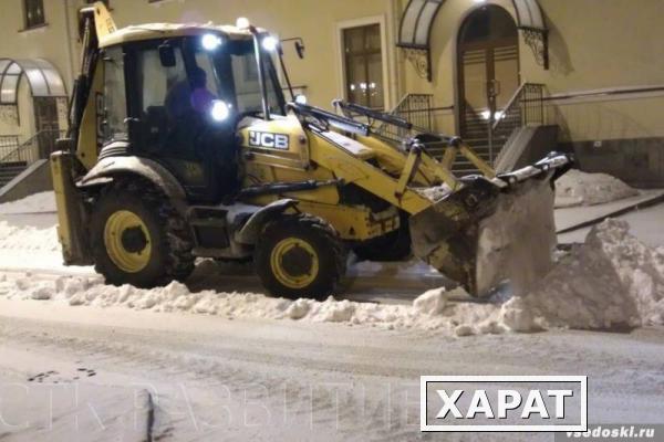 Фото Уборка снега фронтальным погрузчиком