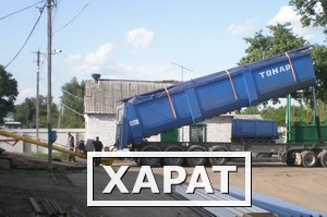 Фото Самосвальный полуприцеп с лючками и желобом для перевозки зерна